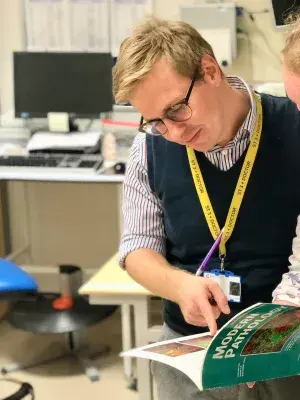 Dr Neil Ryan discusses a journal paper with a colleague